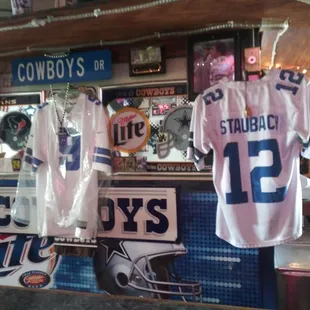 football jerseys hanging on a wall