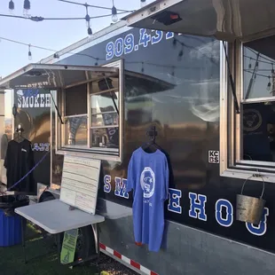 a t - shirt hanging out of a food truck