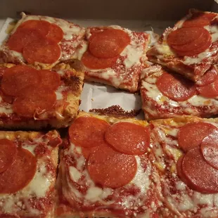 Pizza is placed in sloppily but still pretty good.