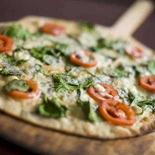 Caprese Pizza (white): roasted tomatoes, fresh basil, EVOO, mozzarella and buffalo mozzarella