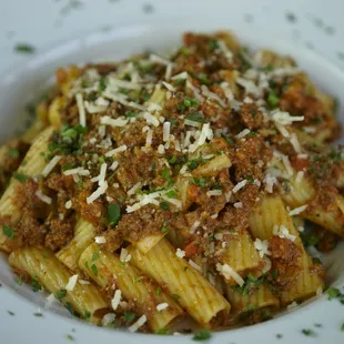 Rigatoni Bolognese: traditional slow-cooked meat ragu, parm, parsley