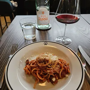 Bucantini all&apos;Amatricana with glass of Barolo