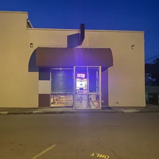 The entrance hidden behind a dollar general.