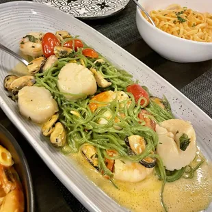 Pasta special - Spinach spaghetti with lemon basil sauce, shrimp, scallops, mussels and cherry tomatoes