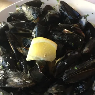 White garlic broth, mussels &amp; angel hair. Fresh lemon wedge atop the &quot;mussel mountain&quot;