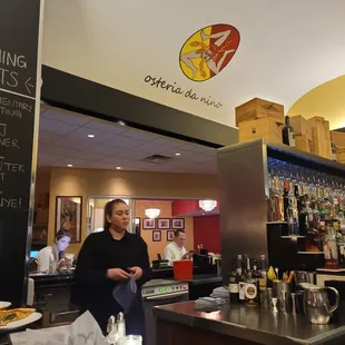 a woman behind the bar