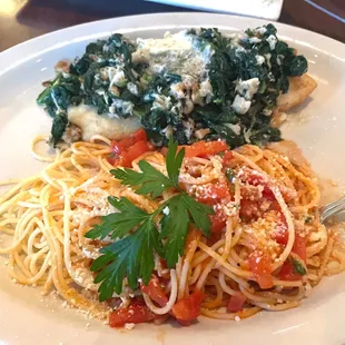 a plate of pasta and spinach