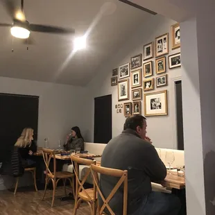 Intimate, limited seating which makes for such a cozy atmosphere. The pictures are of the staff members' family.