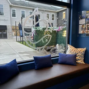 a window seat with pillows