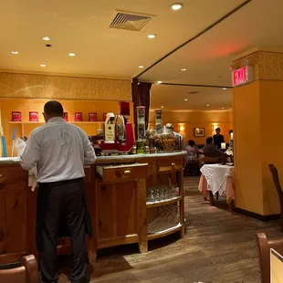 a man standing at a restaurant counter