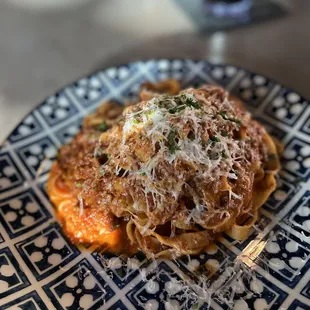 a blue and white plate of pasta