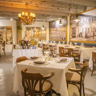 a dining room with tables and chairs