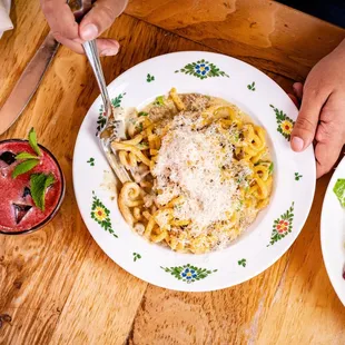 GRAMIGNA: sausage ragu, liaison, scallions, black pepper, parmigiano