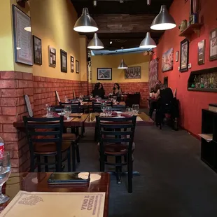 a dining area with tables and chairs