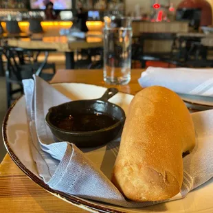 a plate of bread and dipping sauce
