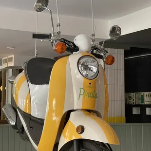 a yellow and white scooter