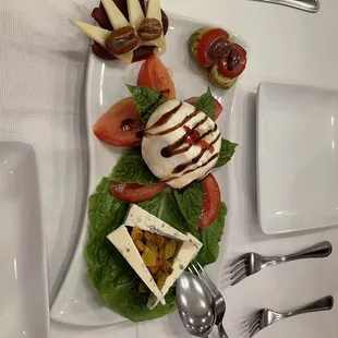 a plate of food and utensils