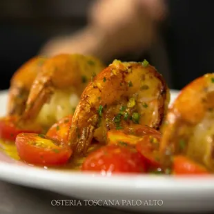 GAMBERONI- grilled jumbo prawns, tomato, garlic, and turmeric