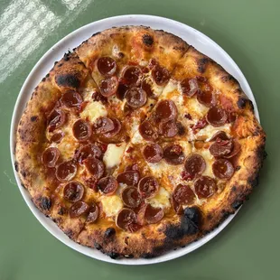 Pepperoni pizza with honey