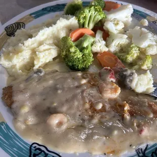 Grilled Catfish with seafood cream sauce, mashed potatoes &amp; mixed veggies