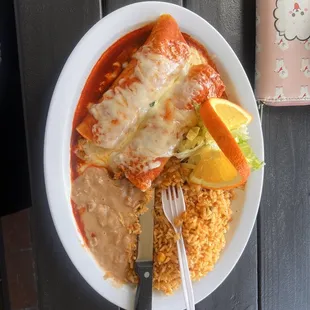 Enchiladas, rice, bean, salad.