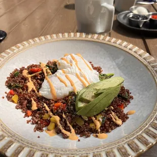 Vegetarian breakfast Bowl. 2 poached eggs, quinoa, avocado,peppers, onion, spinach, spicy aioli Very good, with the eggs perfectly runny.