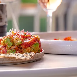 a plate of food and a glass of wine