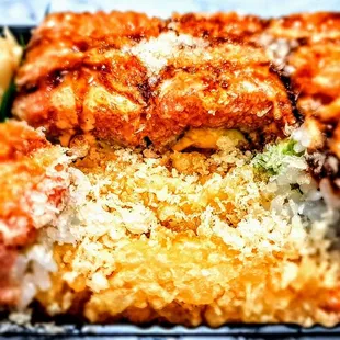 O.M.G Roll: Shrimp Tempura, Avocado, &amp; Mango Rolled Inside, Topped W. Spicy Tuna In Spicy Mayo, Shiracha, &amp; Eel Sauce With Crunch. $16.95