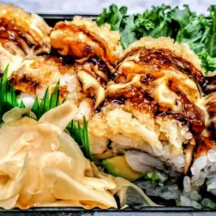 Shrimp Tabasco Roll: Shrimp Avocado Roll Inside Topped With Tempura Shrimp In Chef&apos;s Special Tabasco Mayo &amp; Eel Sauce. $15.95