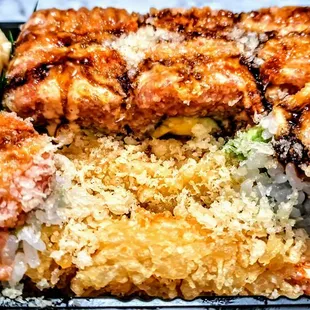 O.M.G Roll: Shrimp Tempura, Avocado, &amp; Mango Rolled Inside, Topped W. Spicy Tuna In Spicy Mayo, Shiracha, &amp; Eel Sauce With Crunch. $16.95