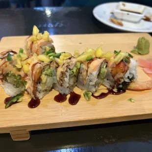 The Cancun roll! Shrimp tempura, avocado roll with cooked shrimp, mango, jalapeño, spicy mayo and eel sauce