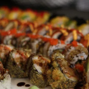 a plate of sushi rolls