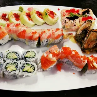 Sushi Rolls! L-R (Top: New O'sushi Roll / Salmon Pizza Sweet Middle: Salmon on the Beach / Snow Corn Bottom: AC Roll / Michigan)