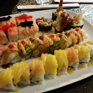 Pizza Roll, Kiss of Fire Roll, White Dragon Roll and Pineapple Sunset Roll