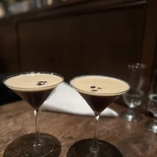 two glasses of coffee on a table