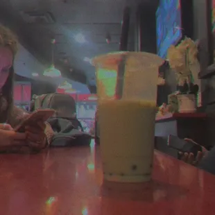 Enjoying some bubble green tea while I wait