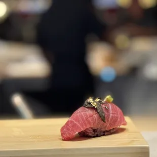 Tuna toro with black truffle and gold leaf