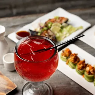 a close up of a glass of crab sushi