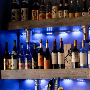 a shelf of liquor bottles