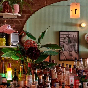 a bar filled with bottles of alcohol