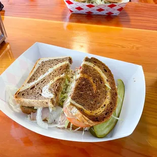 Pastrami &amp; mustard on rye with added turkey, lettuce, tomato, and onion