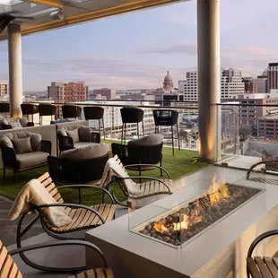 a patio with a fire pit