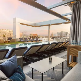 a lounge area overlooking a swimming pool
