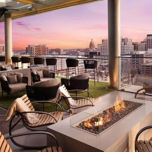 an outdoor patio with a fire pit