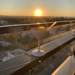 a bowl of food on a balcony