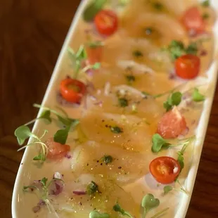 Scallop carpaccio with olive oil.