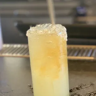 Marg (reposado tequila) topped with grand marnier-$14. One of the best, strongest margs I've ever had. Dope bartender with the dope hat!