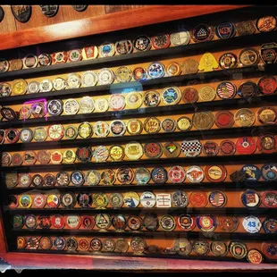 a display of badges on a wall