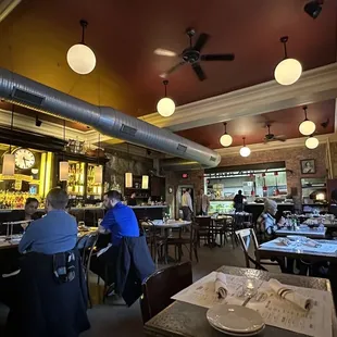 a restaurant with people sitting at tables