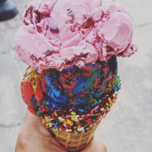 Dark Cherry and Superman ice cream on a Chocolate dipped Sprinkles cone.